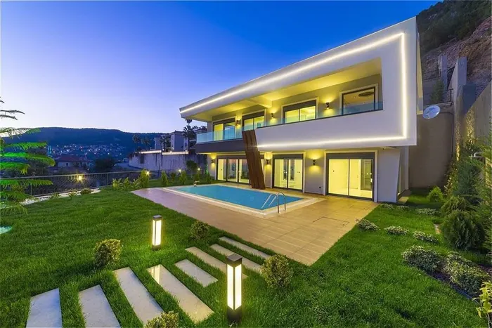 Villa with pool and evening lighting